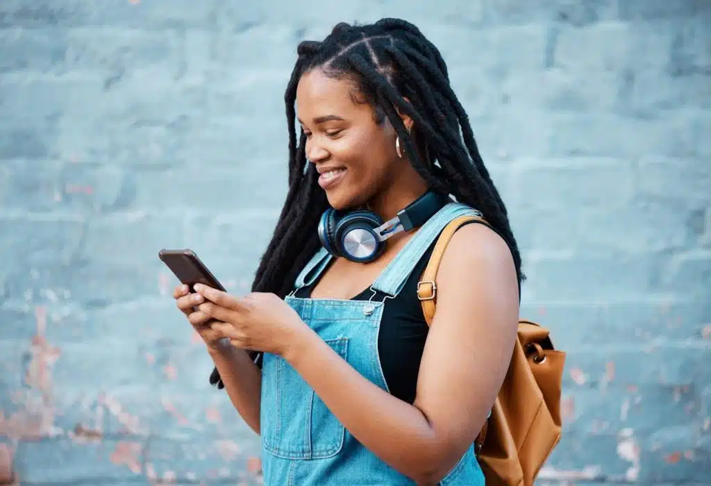 a young woman with headphones studies training to get a bartending license in Ohio