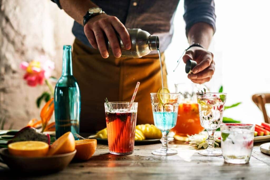 a bartender preparing different drinks