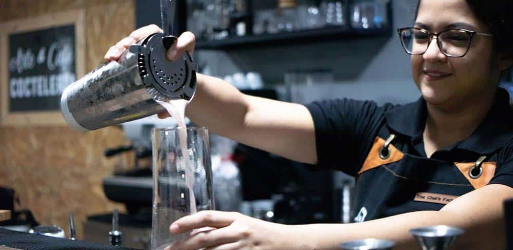 bartender powering drink from a mixer. Alcohol Server Training.